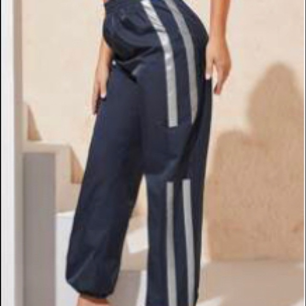 Reflective side wind pants